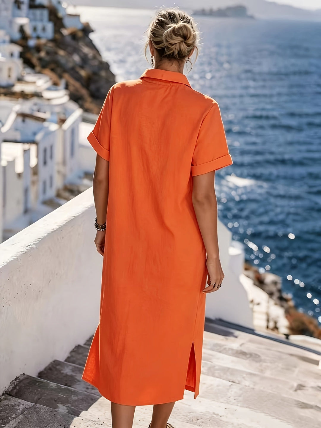 Fashionable women's short sleeve midi shirt dress, button-front and collared detail.
