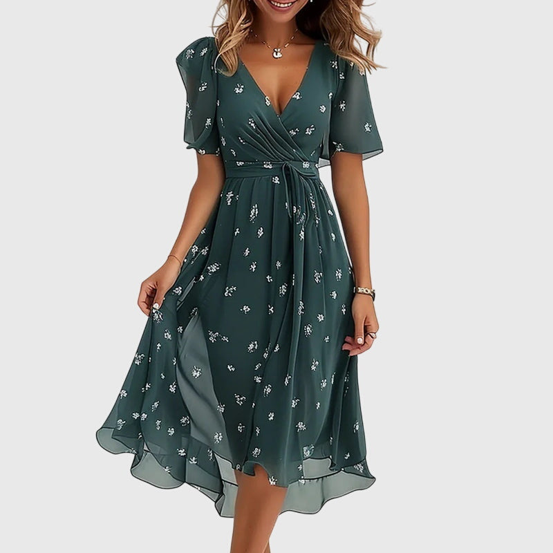 Elegant women's summer midi dress with flutter sleeves. Chic style, versatile for day or special occasion.