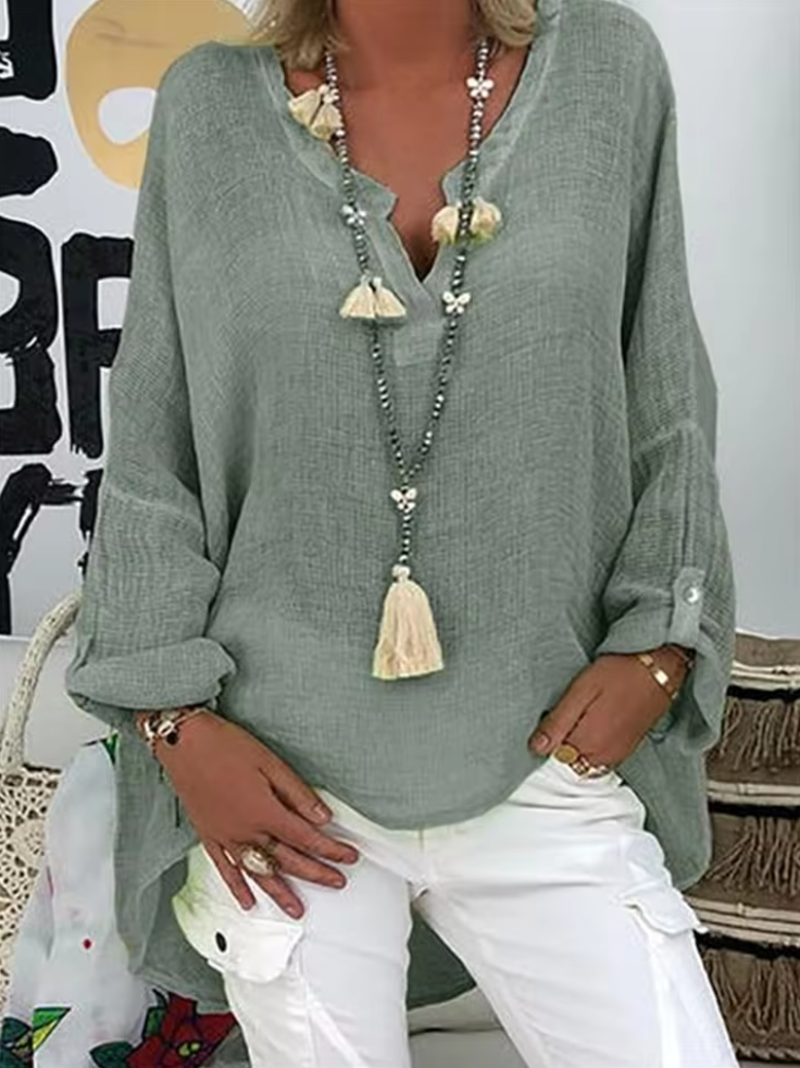 Effortless chic women's oversized blouse top, combining relaxed fit with elegant casual fashion.