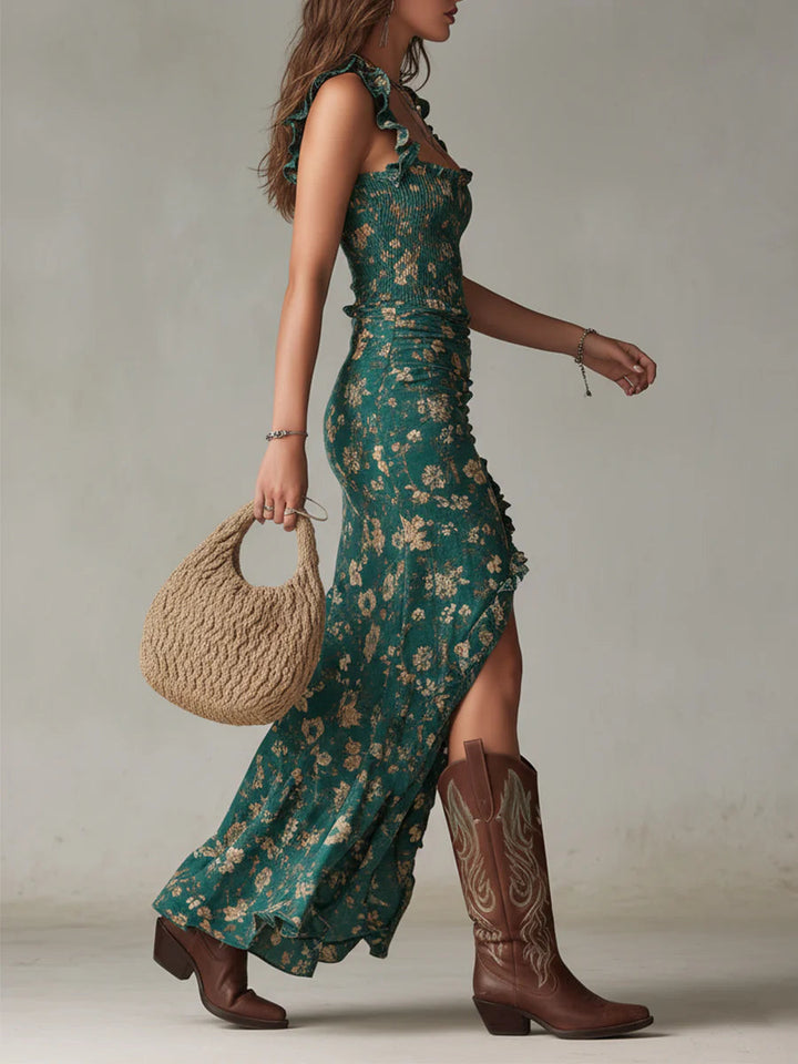 Close-up of green floral maxi dress. Features delicate floral print, smocked bodice, and tiered ruffles. Boho summer style.
