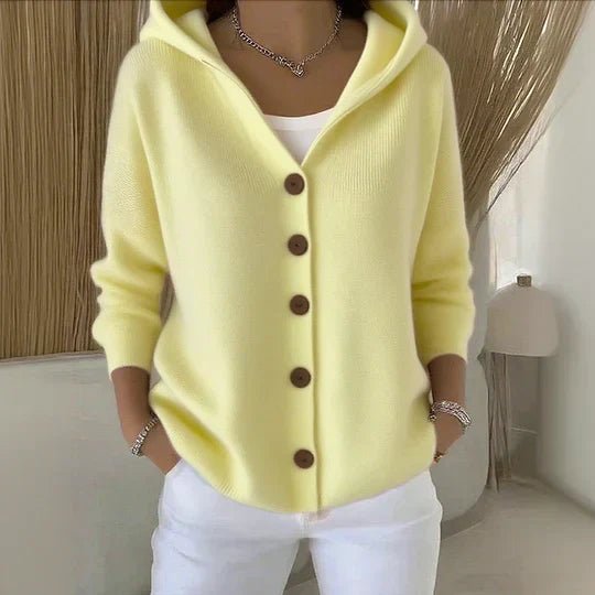Cozy knit women's hooded cardigan sweater, button-front. Relaxed fit layering piece for casual fall wear.