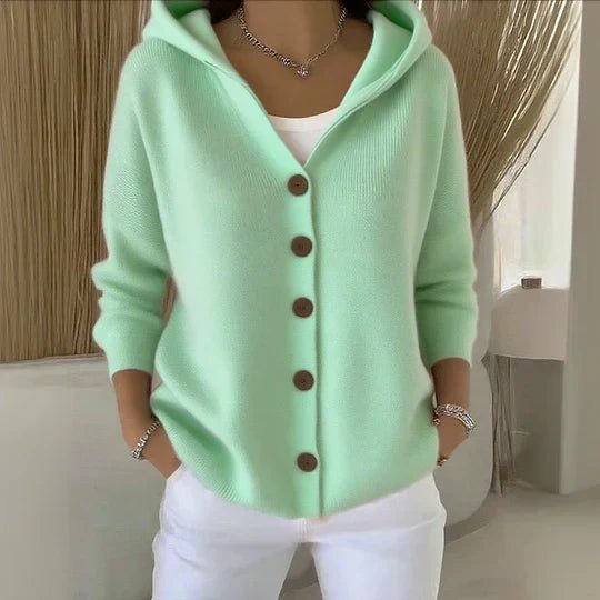 Warm women's hooded button-front cardigan sweater. Relaxed fit, cozy knit, perfect for winter layering.