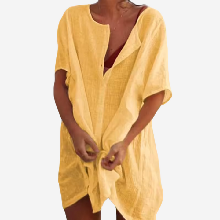 Stylish women's relaxed fit beach cover-up tunic in a breathable linen blend, great for summer resort.