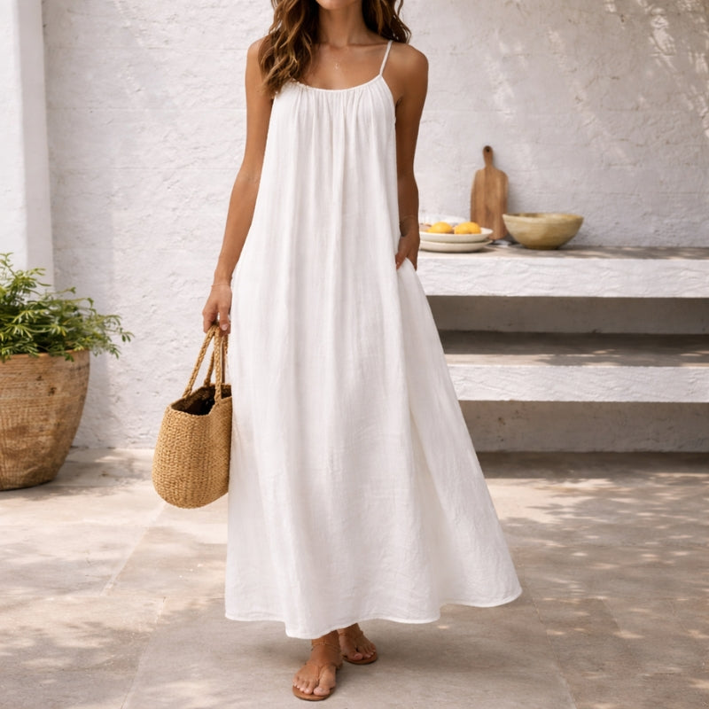 Flowing women's spaghetti strap maxi sundress, ideal beach dress, resort wear & comfortable vacation outfit.