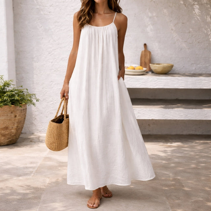Flowing women's spaghetti strap maxi sundress, ideal beach dress, resort wear & comfortable vacation outfit.