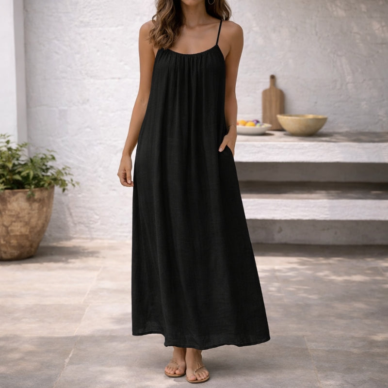 Comfortable, elegant women's maxi sundress with pockets & scoop neck, great for warm weather & casual style.