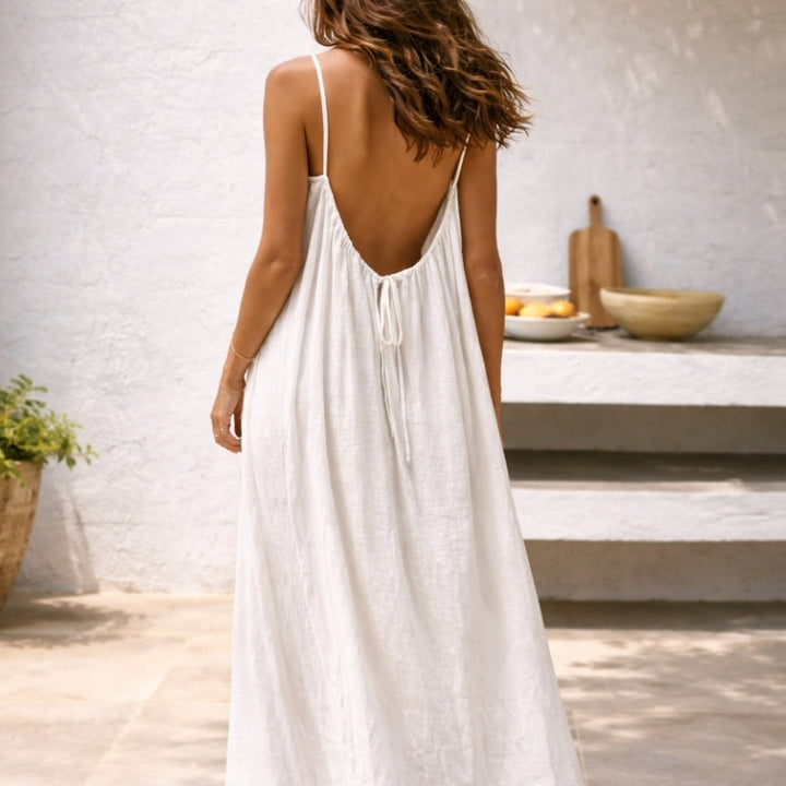 Women's warm weather maxi sundress, comfortable and stylish with spaghetti straps, pockets & flowing design.