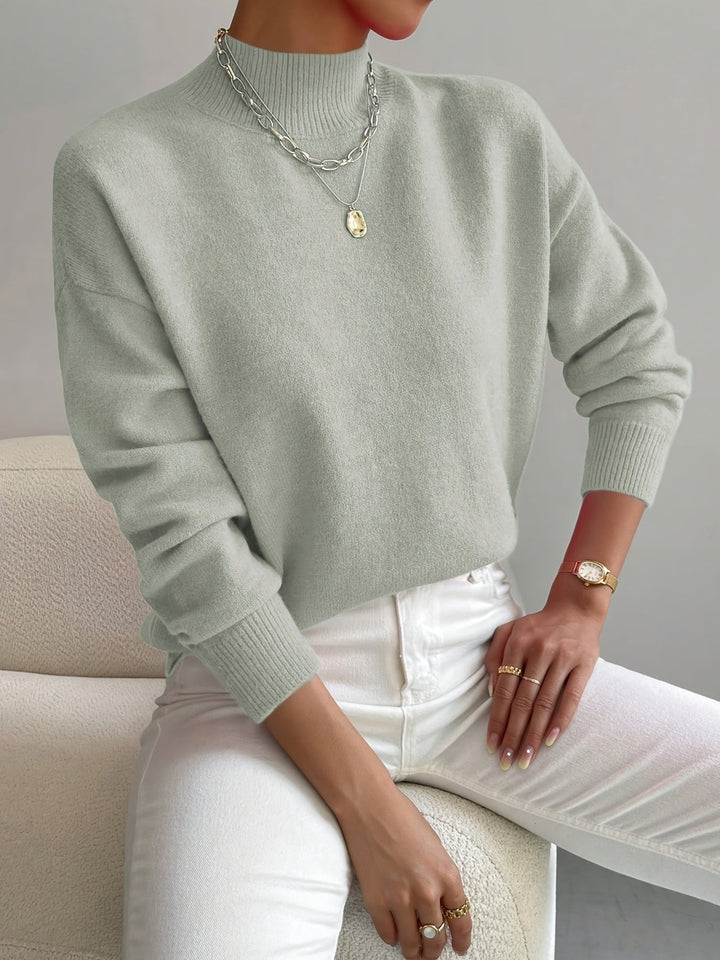 Women's effortless mock turtleneck relaxed fit long sleeve sweater. Ideal for fall fashion.