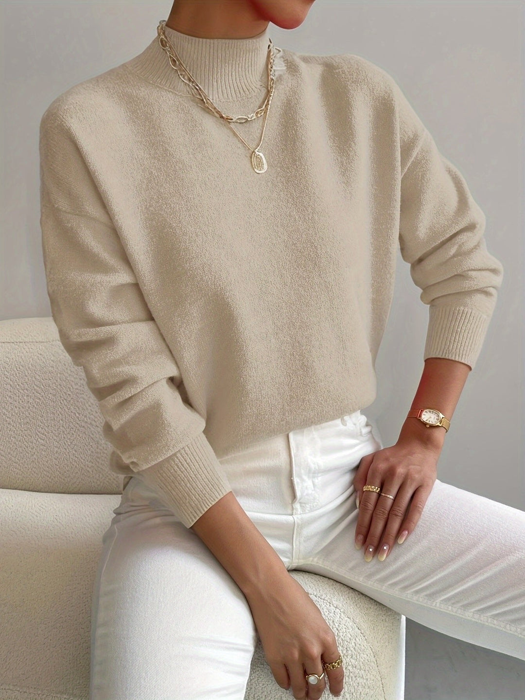 Chic women's long sleeve mock turtleneck sweater. Versatile fall & winter fashion knitwear.