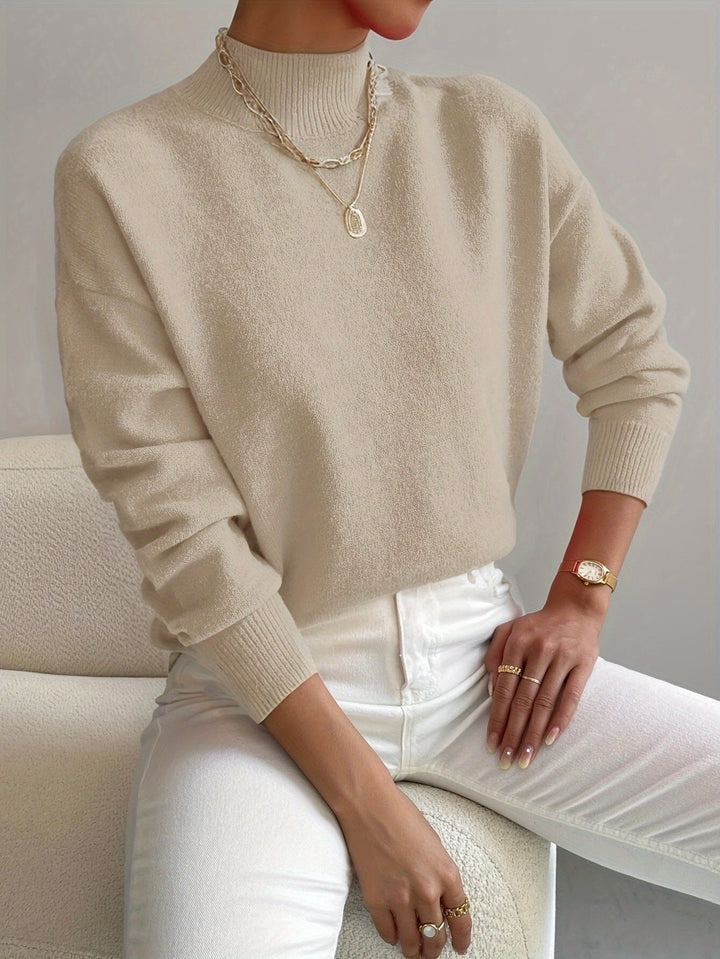 Chic women's long sleeve mock turtleneck sweater. Versatile fall & winter fashion knitwear.