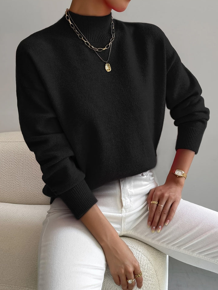 Women's cozy mock turtleneck sweater. Relaxed fit pullover for casual outings or office looks.