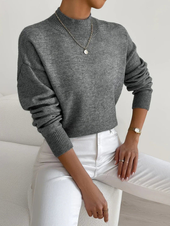 Fashionable women's long sleeve mock turtleneck. Relaxed fit knitwear, perfect for layering.