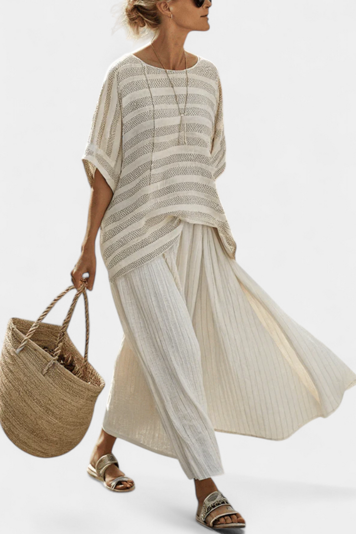 Women's effortless multi-color striped batwing top & flowy maxi skirt two-piece set for summer coastal style.