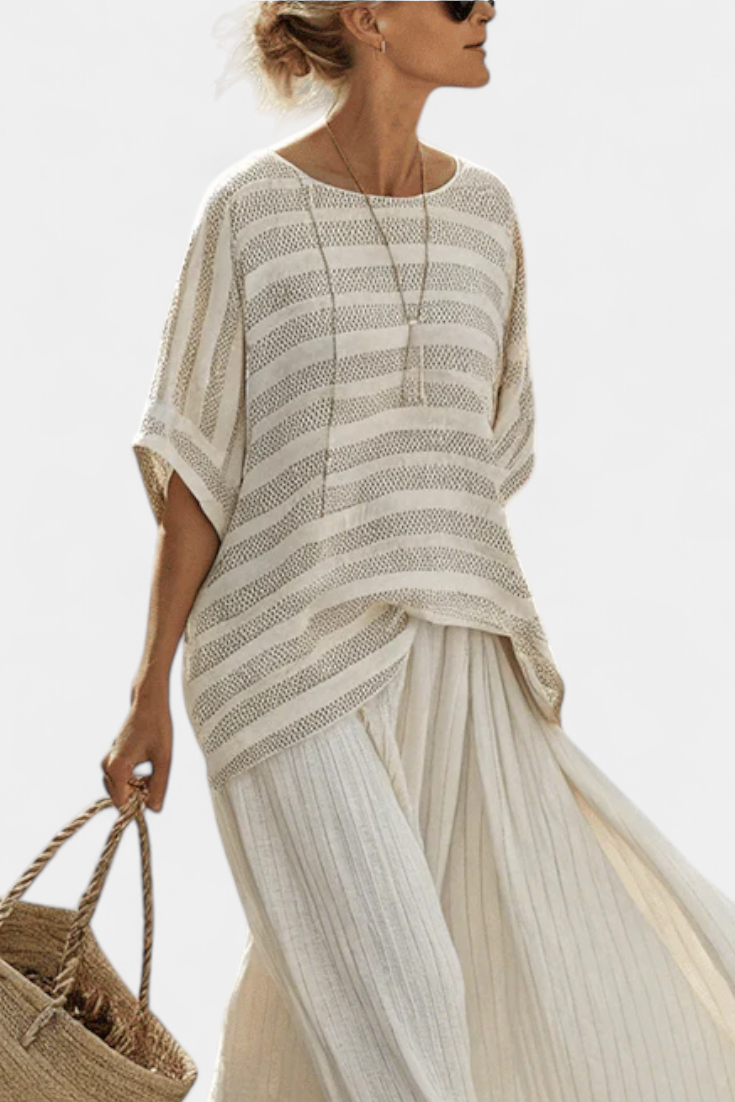 Elegant women's striped batwing top & flowy maxi skirt set. Perfect multi-color two-piece for relaxed resort wear.