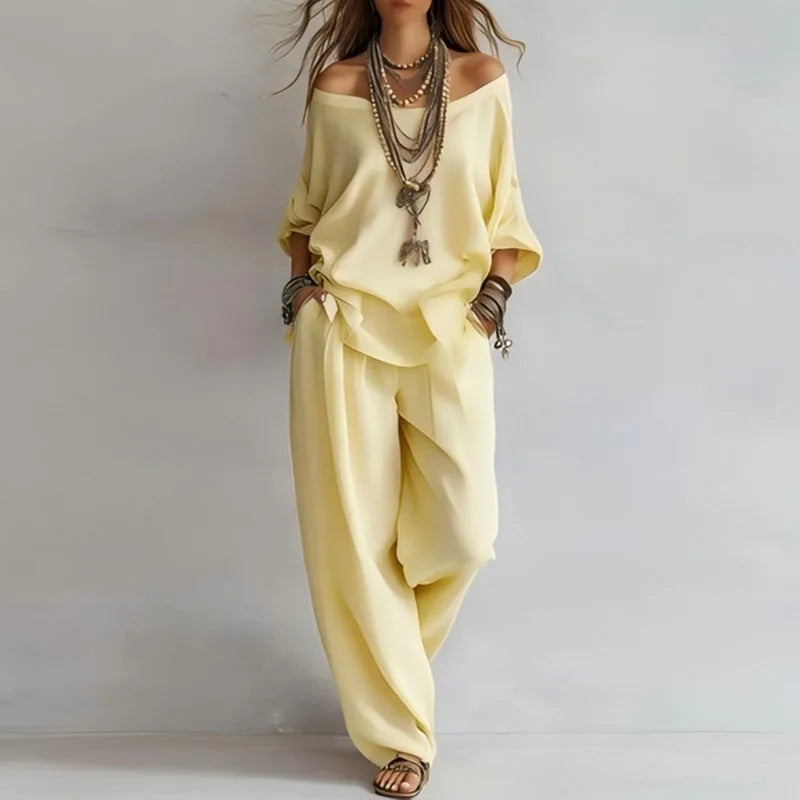 Comfortable women's off-shoulder top and wide-leg pants co-ord set. Effortless two-piece summer lounge outfit.