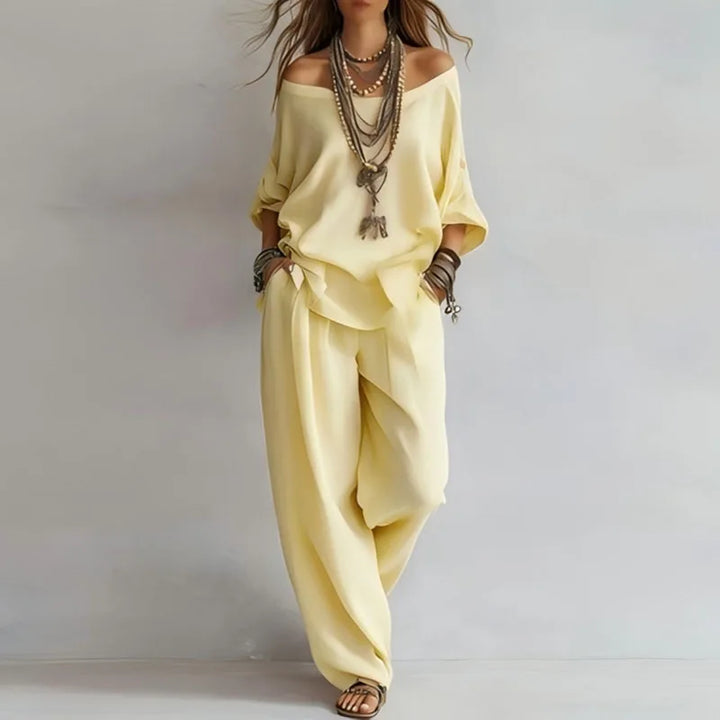 Comfortable women's off-shoulder top and wide-leg pants co-ord set. Effortless two-piece summer lounge outfit.