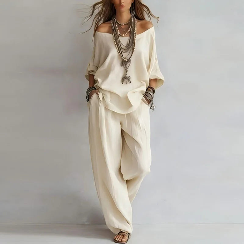 Soft women's off-shoulder co-ord set. Loose-fit two-piece lounge outfit with wide-leg pants, ideal for casual comfort.