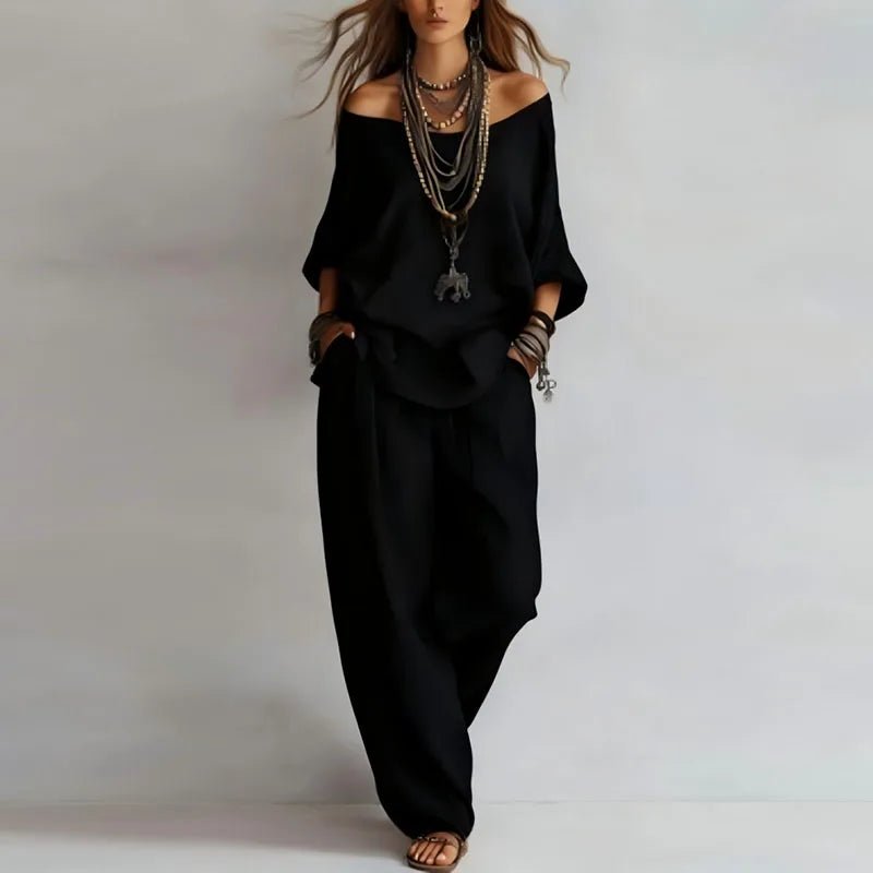 Chic women's off-shoulder co-ord set featuring a comfortable top and trendy wide-leg pants. Perfect for summer.