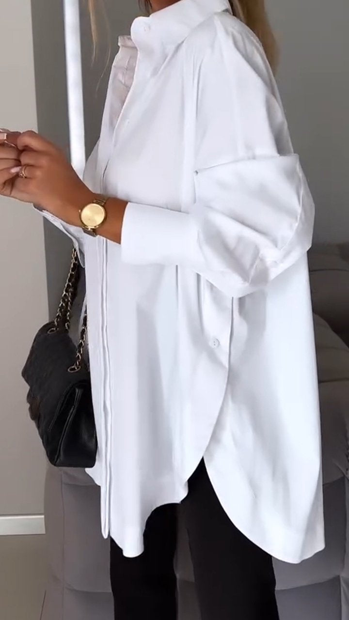 Plus size women's oversized collared blouse, offering a flattering relaxed fit for versatile style.