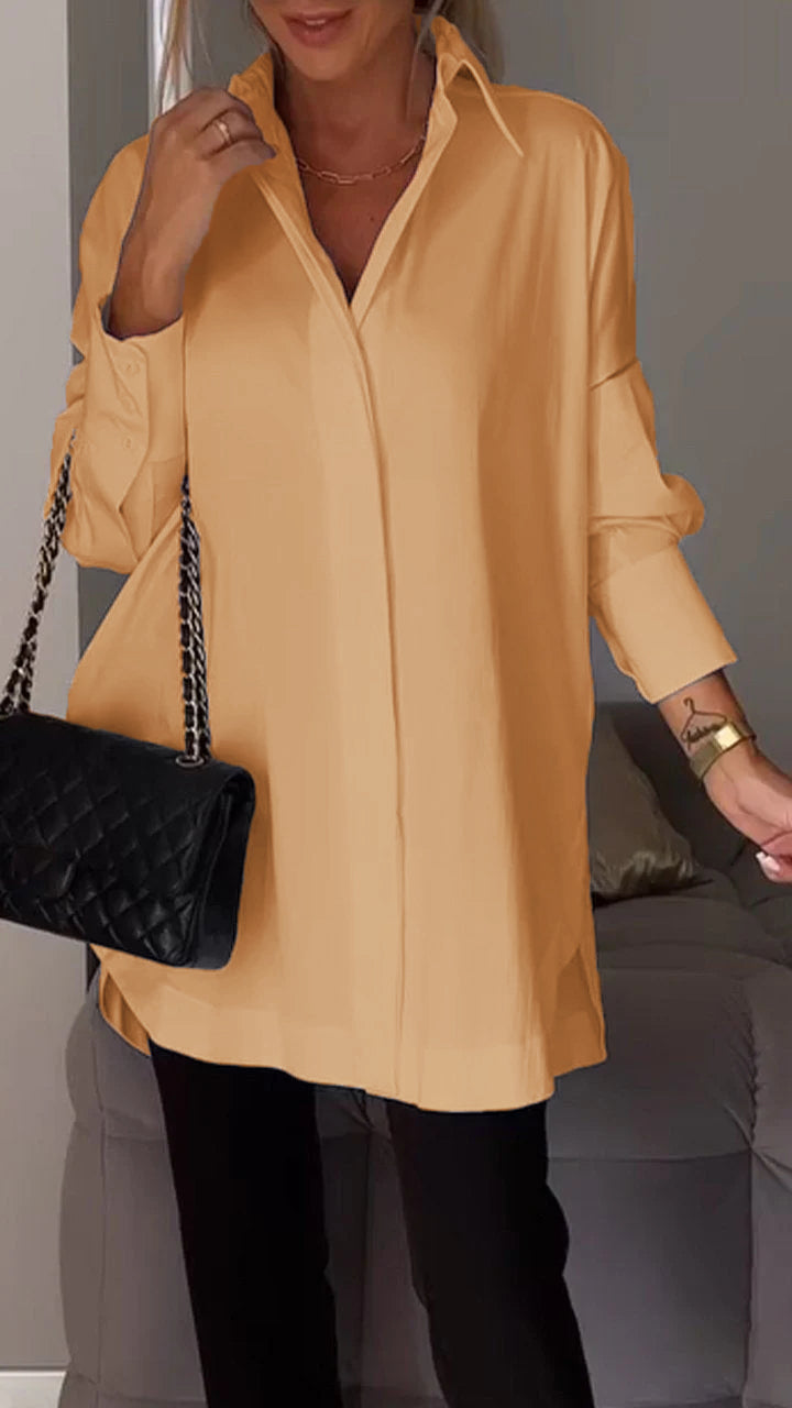Professional women's oversized workwear blouse with collar, offering a stylish yet comfortable long sleeve fit.