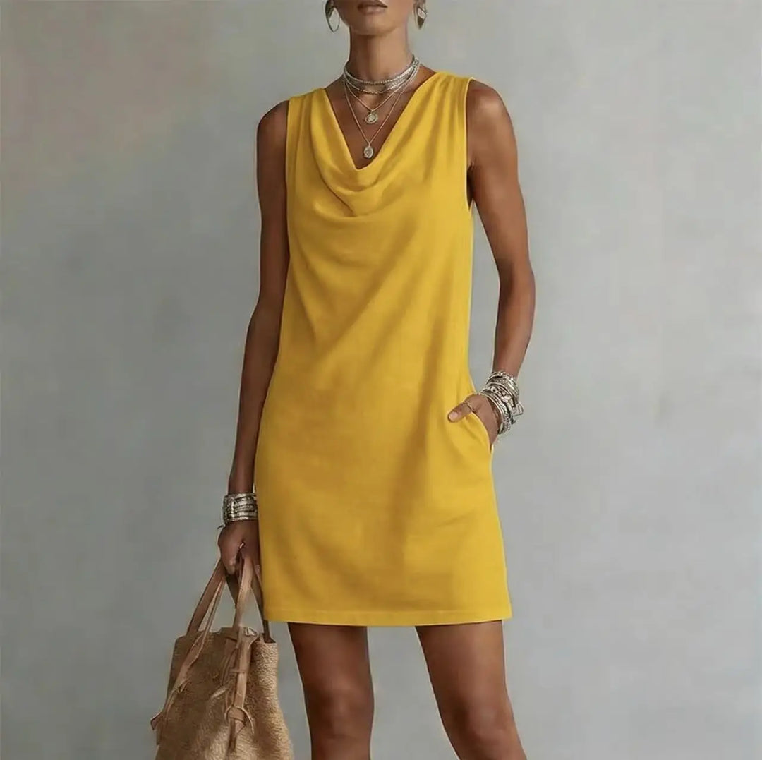 Effortless women's sleeveless mini dress for warm weather, great for vacation, beach, or casual wear. Has pockets.