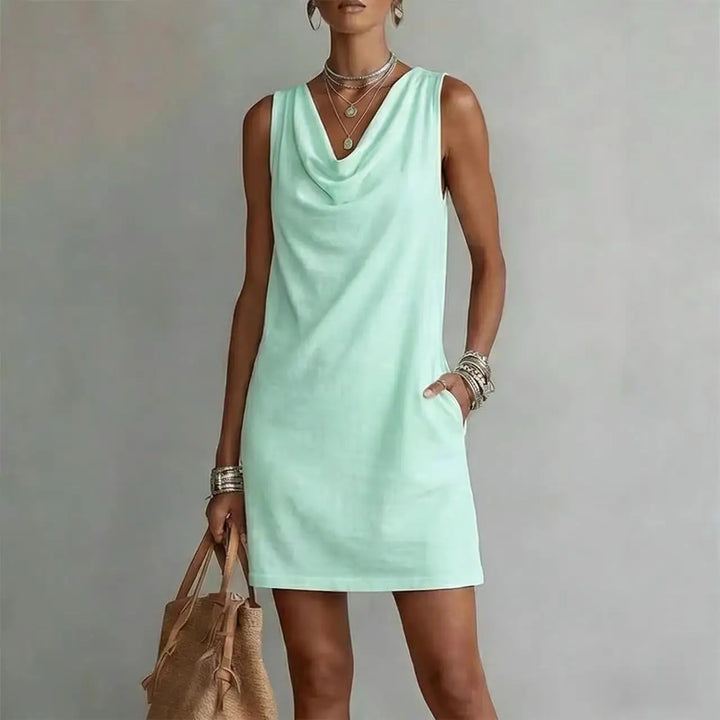 Comfortable women's mini dress with a relaxed fit and draped neckline. Ideal lightweight summer or everyday wear.