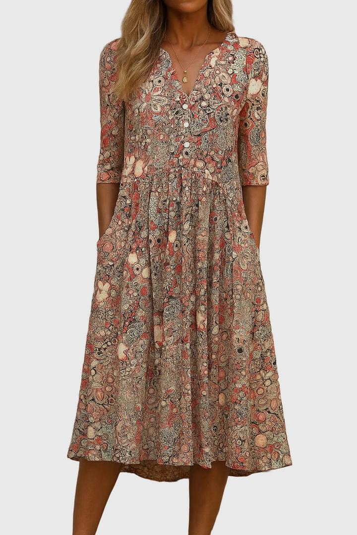 Women's effortless printed V-neck midi dress with three-quarter sleeves, flowy relaxed fit, perfect for summer casual elegance.