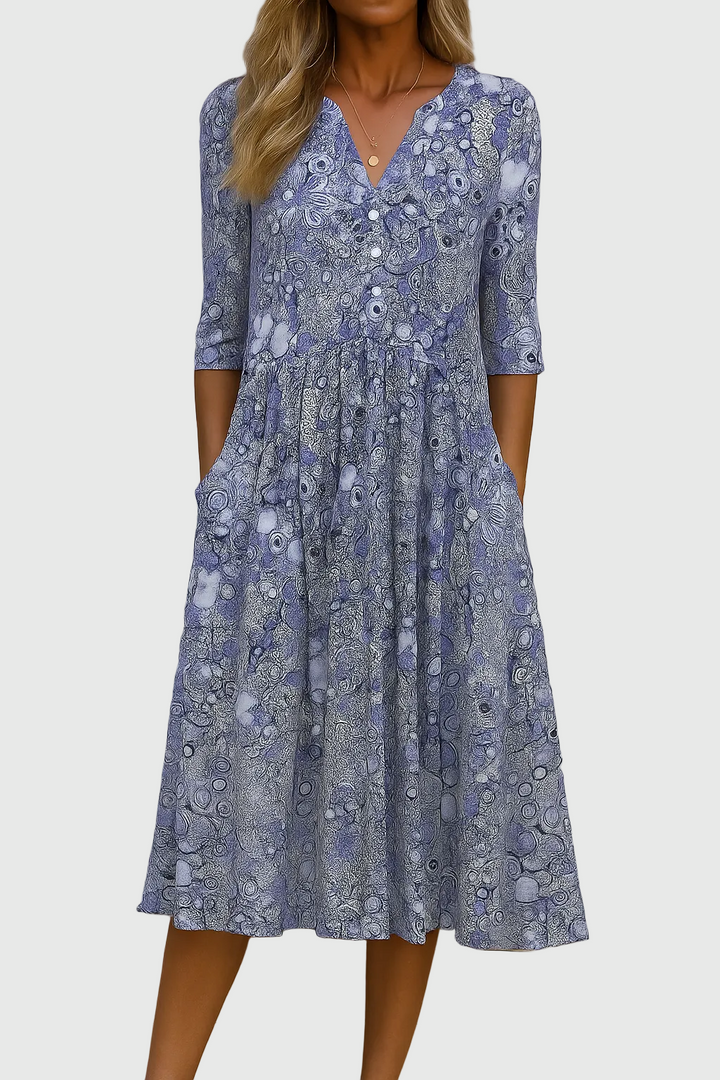 Comfortable women's printed V-neck midi dress, three-quarter sleeves, flowy design for versatile spring and summer styling.