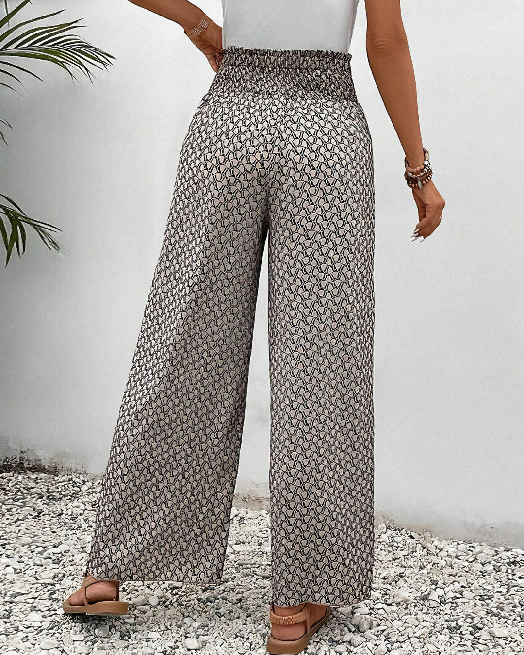Stylish women's wide-leg pants with elastic waist, offering a flowy, relaxed fit for casual chic outfits.