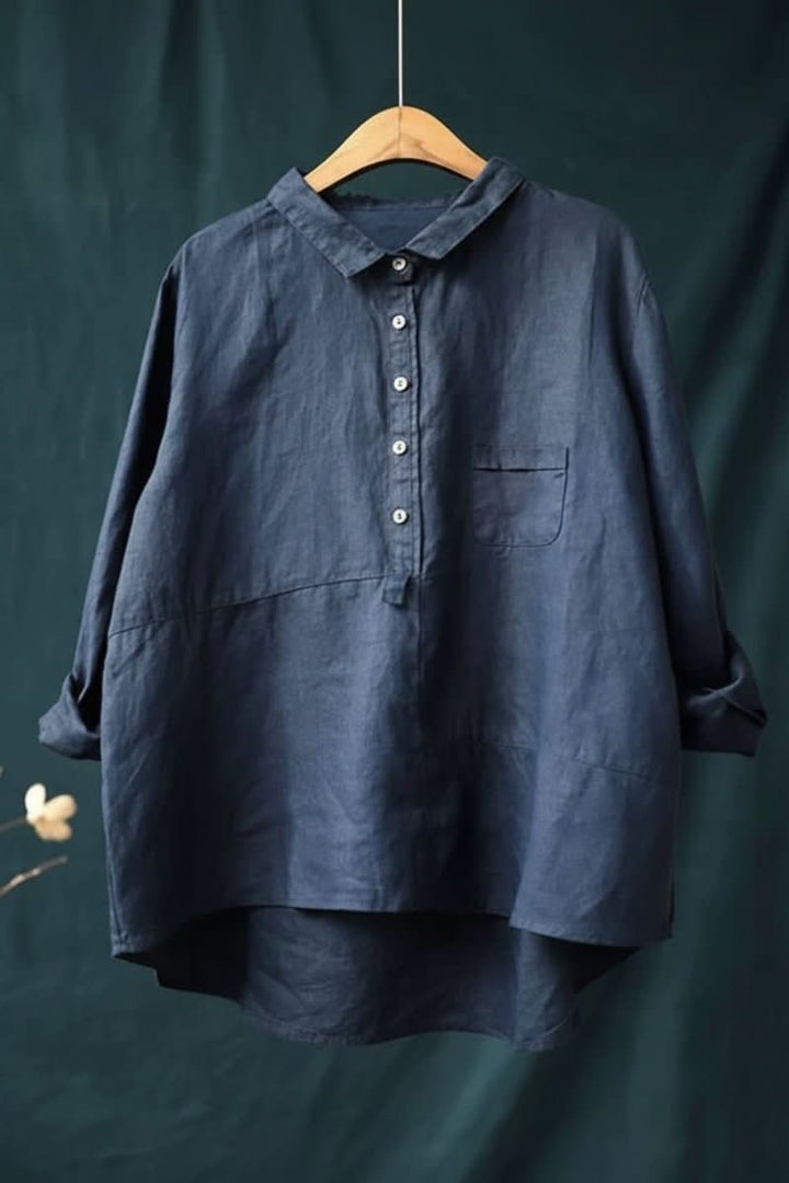 Versatile women's long sleeve work blouse, offering comfort and hip-length style.