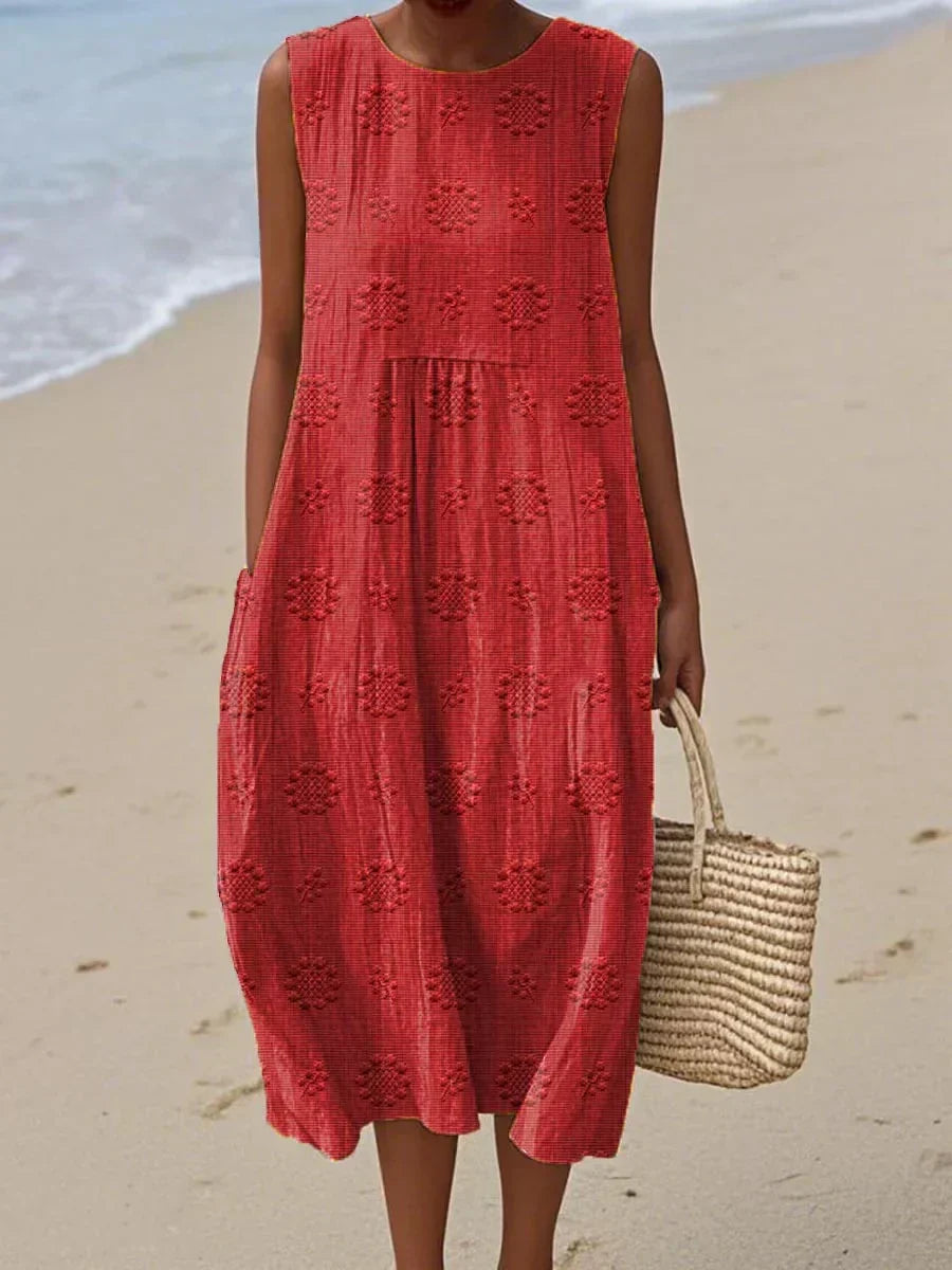 Easy care, comfortable women's summer midi dress, relaxed fit, sleeveless, with pockets for effortless style.