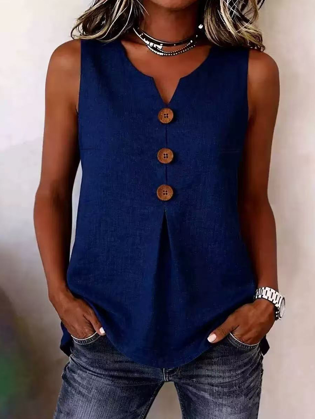 Stylish women's V-neck tank top, a comfortable sleeveless blouse with a flowing pleated front for casual summer wear.