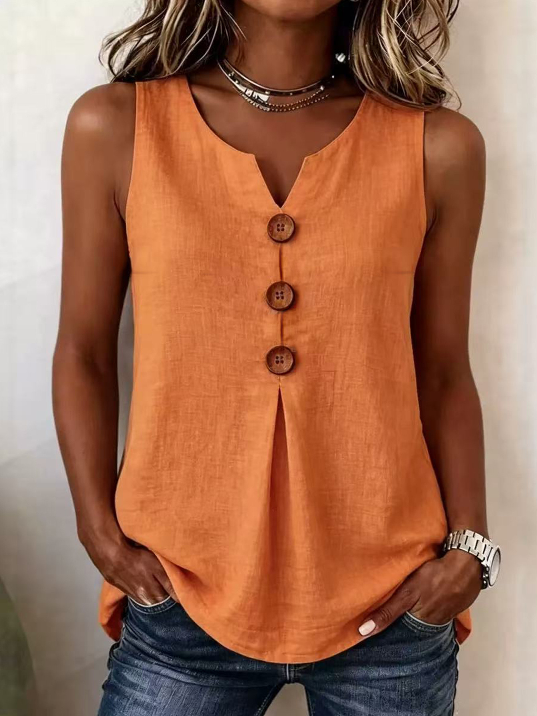 Modern women's V-neck sleeveless blouse with a soft pleated front. Great loose-fit top for comfortable everyday wear.
