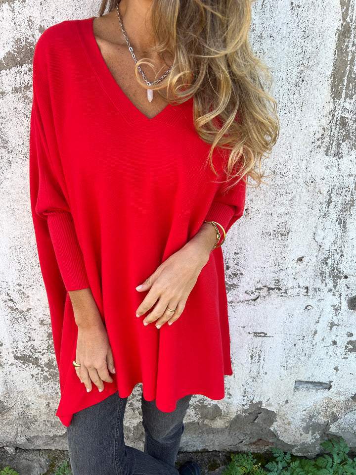 Chic women's V-neck swing tunic sweater styled for fall fashion. Comfortable, versatile pullover with relaxed fit.