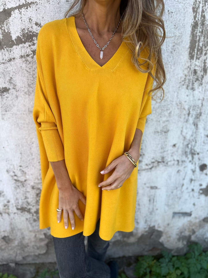Stylish women's V-neck swing tunic pullover sweater in a versatile color. Cozy & comfortable for everyday wear.