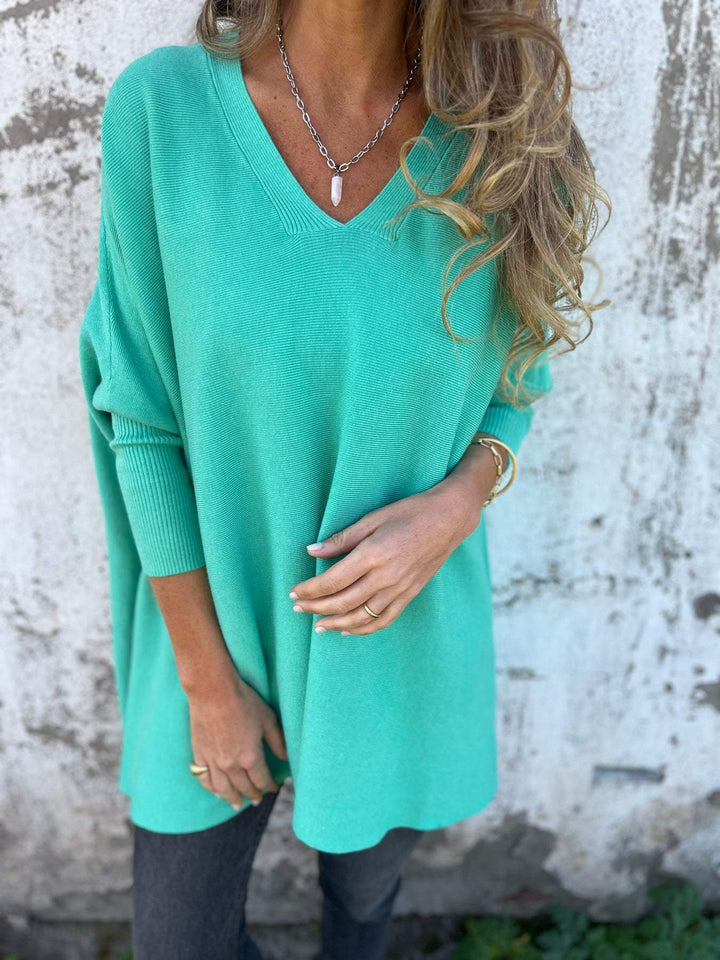 Effortless women's V-neck swing tunic sweater; a comfortable & versatile pullover perfect for casual fall & winter outfits.