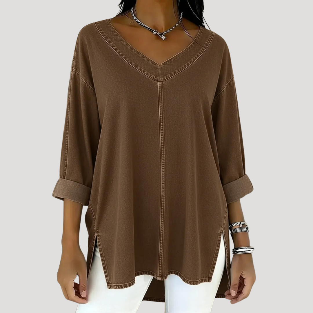 Chic women's v-neck tunic top featuring elbow sleeves and practical side slits. Ideal for casual, versatile outfits.