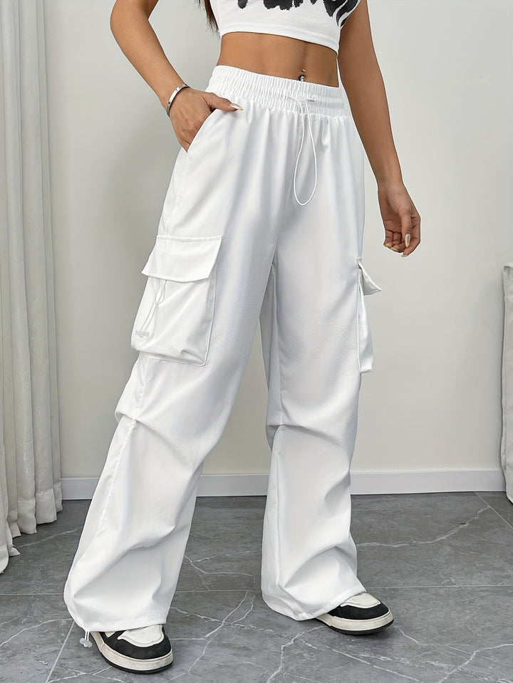Women's effortless wide leg cargo pants with drawstring waist in a relaxed fit. Perfect for casual streetwear.