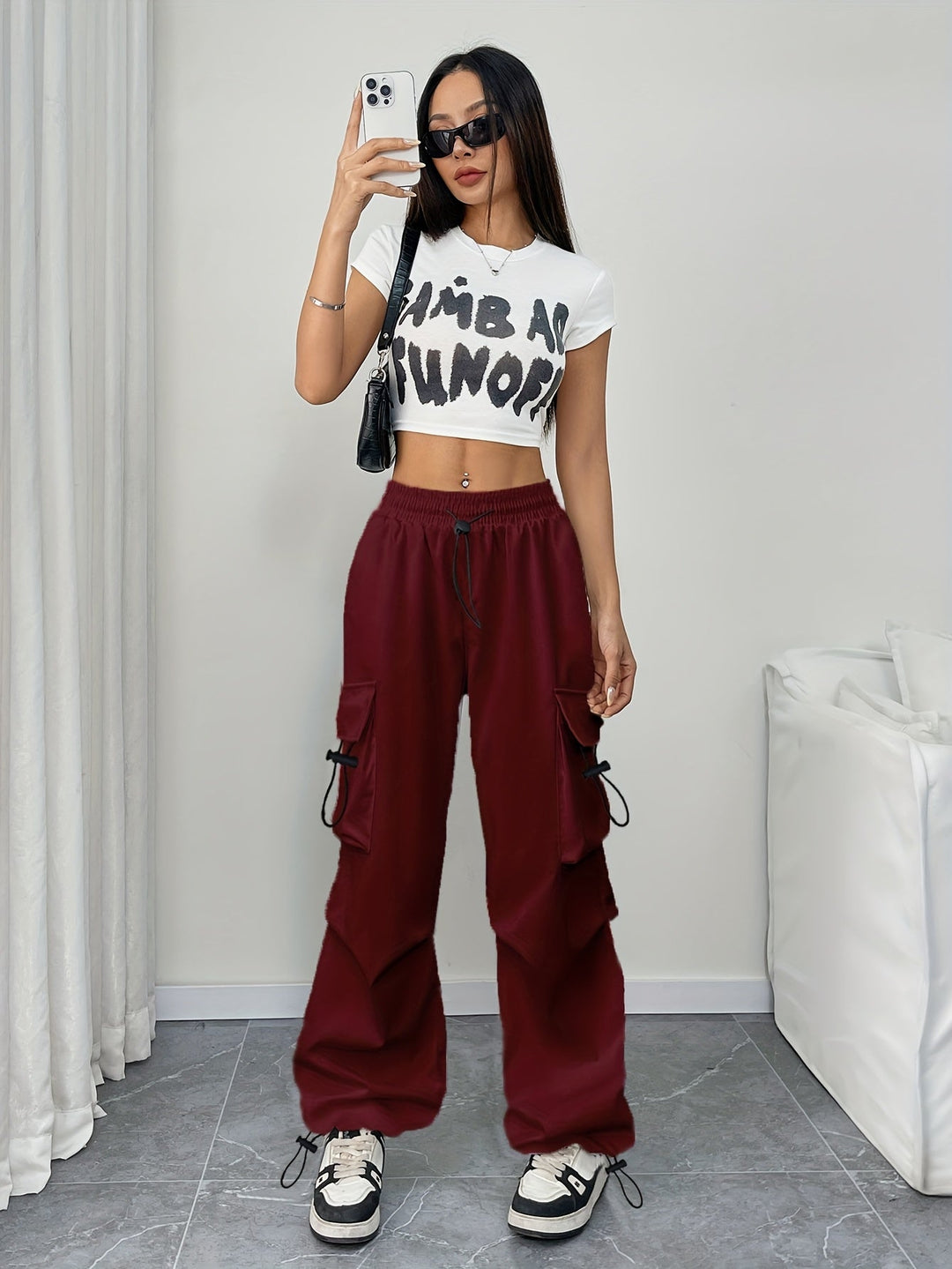 Effortless wide leg cargo pants for women, featuring a drawstring waist & utility pockets for everyday fashion.