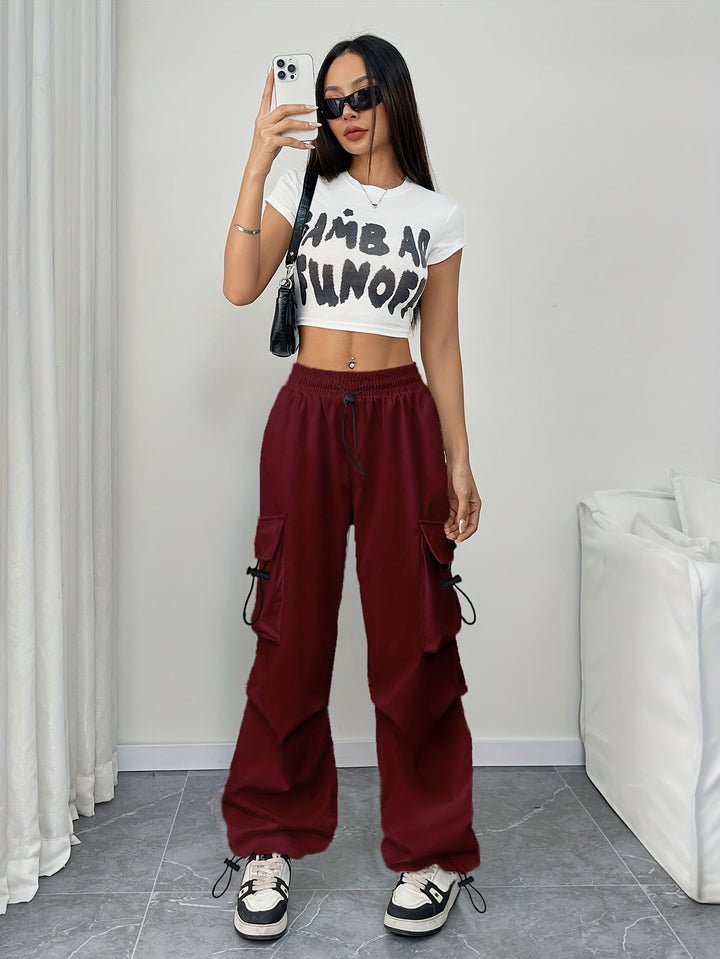 Effortless wide leg cargo pants for women, featuring a drawstring waist & utility pockets for everyday fashion.