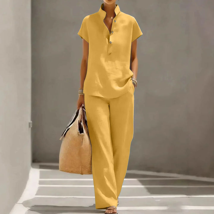 Comfortable women's matching wide-leg pants and button-up top set. Relaxed fit for summer casual wear.