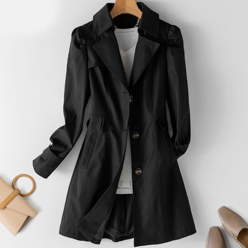 Elegant women's tailored trench coat with structured fit, ideal long jacket for office wear or sophisticated casual fashion.