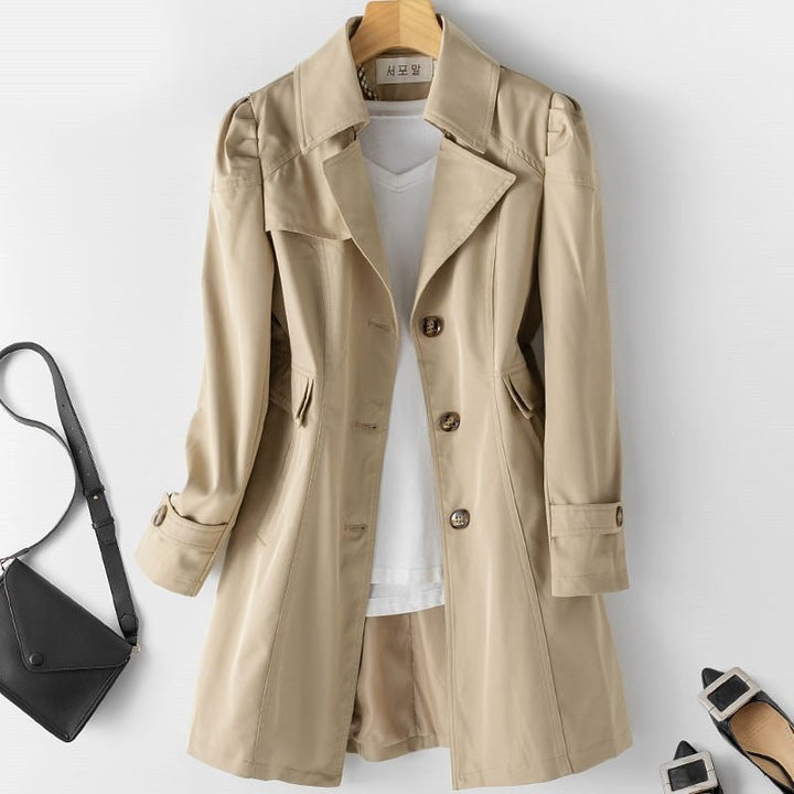 Classic women's long trench coat, a versatile outerwear piece for stylish evening wear, business, or casual autumn looks.