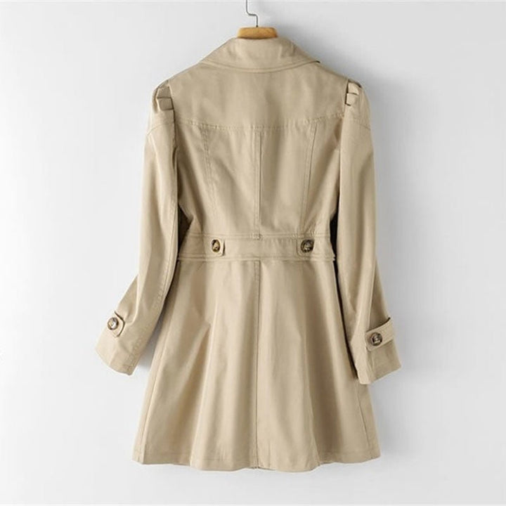 Woman wearing a chic tailored trench coat, a classic long jacket that blends elegance with modern everyday fashion.