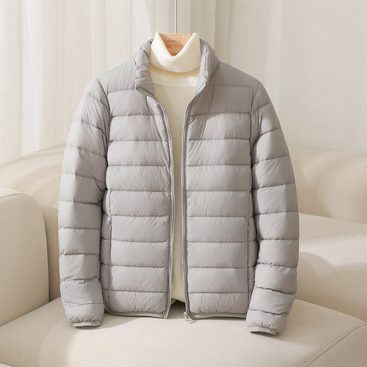 Blue women's Elara quilted puffer jacket, a stylish & lightweight cold weather outerwear option.