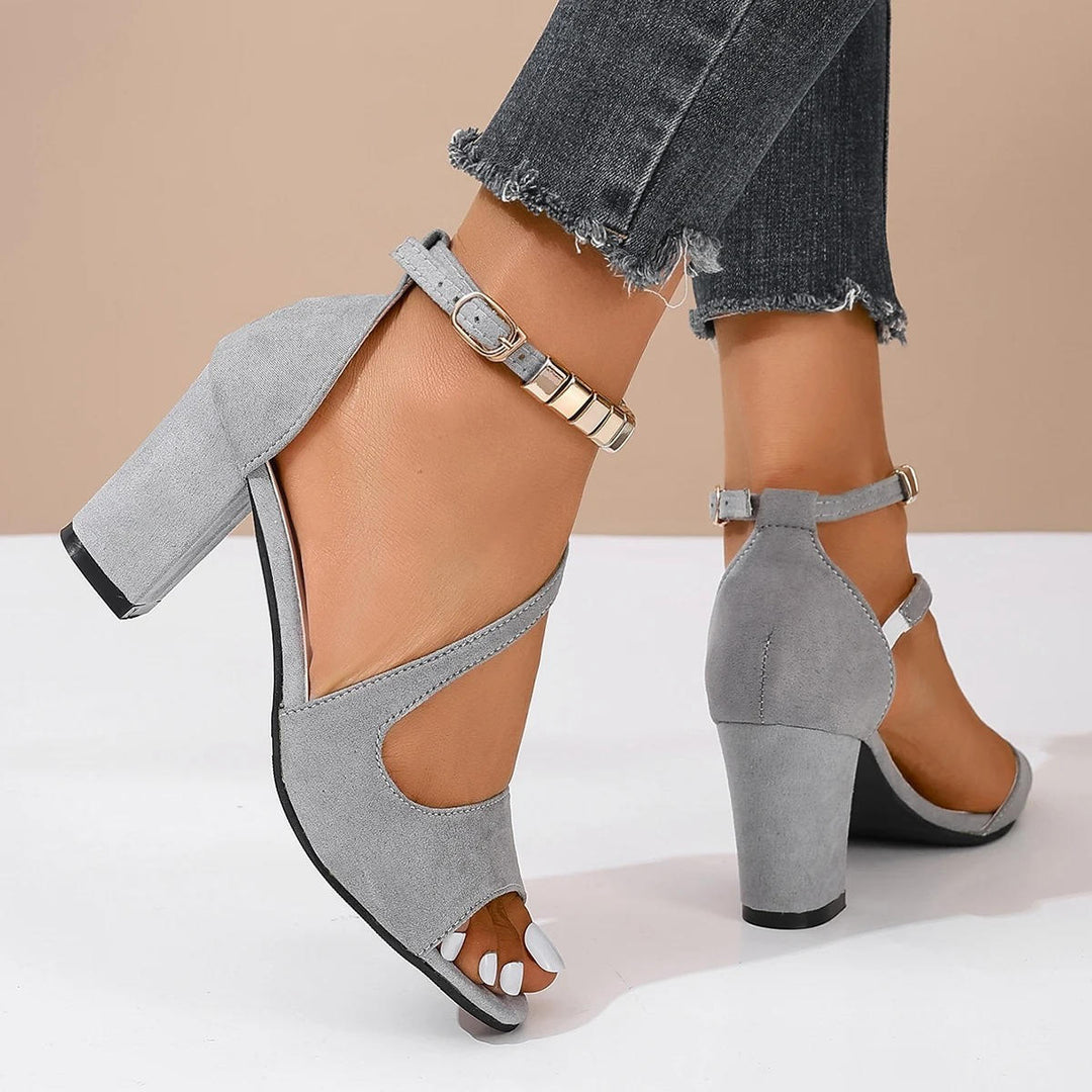 Modern women's open toe block heel sandals, featuring a sparkling beaded ankle strap for elegance.