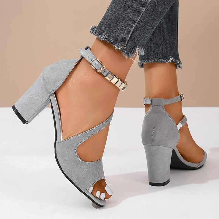 Modern women's open toe block heel sandals, featuring a sparkling beaded ankle strap for elegance.