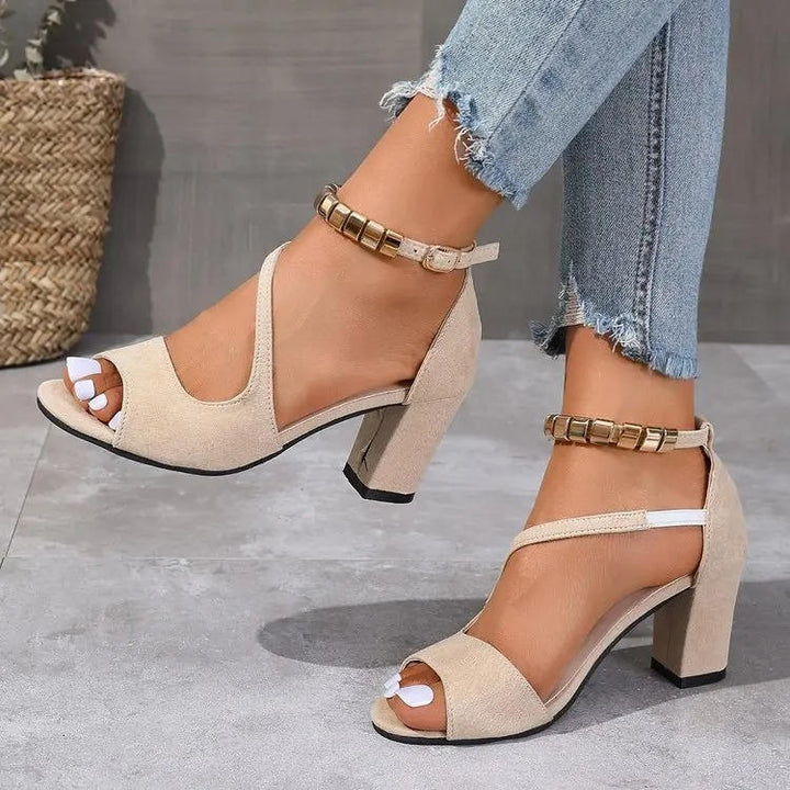 Dressy women's sandals: open toe, stable block heel, and sparkling beaded ankle strap detail.