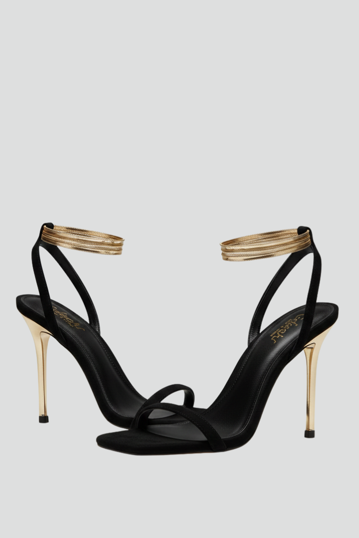 Women's elegant black heeled sandals with delicate ankle strap, perfect for evening wear & parties.