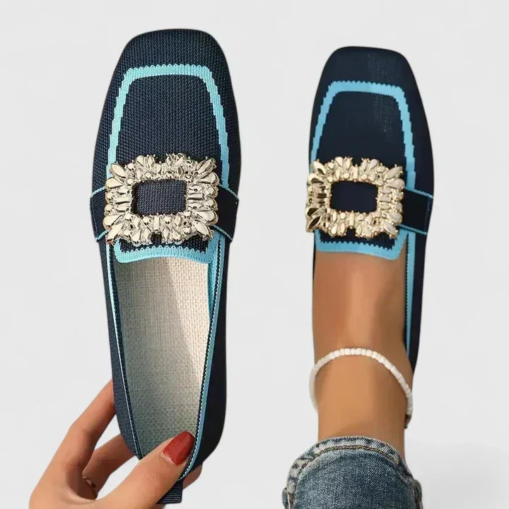 Classic black women's square-toe flat loafers with a decorative crystal buckle, offering elegance and comfort.